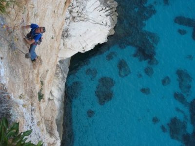 Peter climbing the 7a pitch of Abissi, Falesia dei Falchi, on the east coast of Sardinia